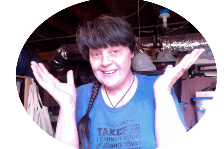 Thea smiling with hands in air